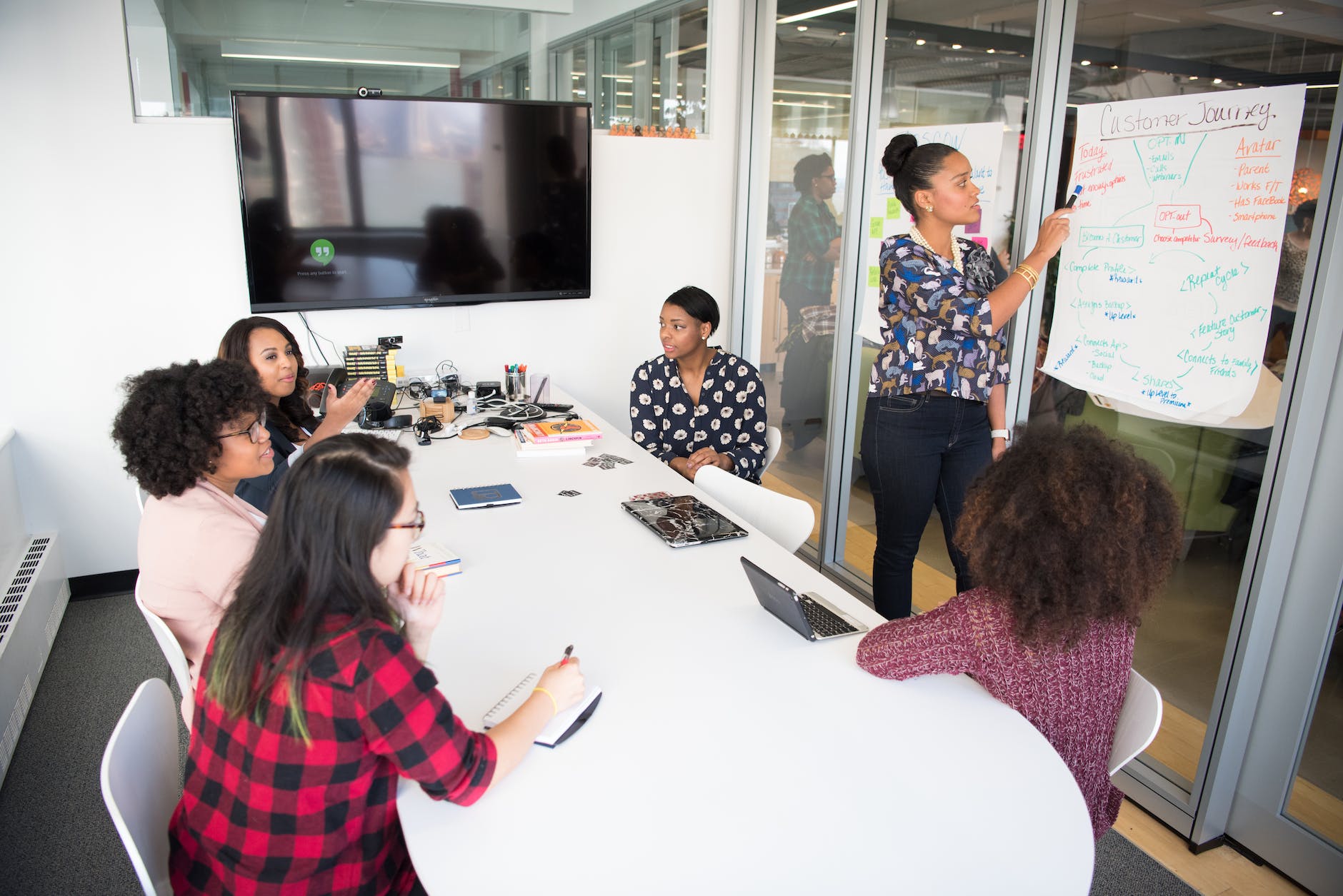 women colleagues gathered inside conference room